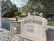 Community sign with a stone base and sculpted letters indicates the entrance to Thraemoor in the Park at 6701 W Yale Ave, Lakewood, CO 80227
