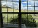 Expansive window provides picturesque views of the lush green landscape outside at 6701 W Yale Ave, Lakewood, CO 80227