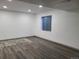 Basement features new floors, neutral paint, recessed lighting, and one window at 9133 W Cedar Dr # A, Lakewood, CO 80226