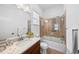 Bathroom features a tub, shower, modern vanity, and a spacious countertop at 7814 S Grand Baker Ct, Aurora, CO 80016