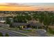 Community center and pool at sunset, with green spaces and surrounding landscape, a luxurious retreat at 7814 S Grand Baker Ct, Aurora, CO 80016