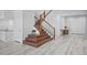 Stylish staircase featuring wooden steps, a wooden railing, and modern flooring at 7814 S Grand Baker Ct, Aurora, CO 80016