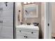 Clean bathroom vanity with white cabinets and a sleek sink at 5065 Eliot St, Denver, CO 80221