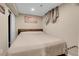 Spacious basement bedroom with a comfortable queen-size bed at 5065 Eliot St, Denver, CO 80221