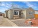 Updated ranch home with a landscaped yard and spacious driveway at 5065 Eliot St, Denver, CO 80221