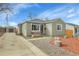 Charming ranch home with a landscaped yard and detached garage at 5065 Eliot St, Denver, CO 80221