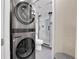 Modern laundry room with LG washer and dryer, adjacent to bathroom at 5065 Eliot St, Denver, CO 80221