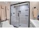 Updated bathroom with a large walk-in shower and modern fixtures at 5065 Eliot St, Denver, CO 80221