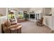Cozy living room featuring neutral decor, comfortable seating, and ample natural light at 10 Oakmont Ln, Littleton, CO 80127