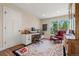 Charming home office with bright windows, a classic desk, and a comfortable leather chair at 10 Oakmont Ln, Littleton, CO 80127