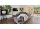 Modern living room with stylish furniture, a fireplace, and large windows providing ample natural light at 1497 S Garfield St, Denver, CO 80210