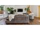 Cozy living room featuring a comfortable gray sofa, fireplace, and large windows, creating a warm atmosphere at 1497 S Garfield St, Denver, CO 80210