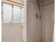 Bathroom shower with tile and updated hardware at 1497 S Garfield St, Denver, CO 80210
