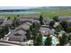 Aerial view of community featuring homes, landscape, and a pool area at 12919 W Burgundy Dr, Littleton, CO 80127