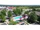 Aerial view of community pool with surrounding landscaping and residential buildings at 12919 W Burgundy Dr, Littleton, CO 80127