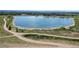 Aerial view of a lake with surrounding park and residential areas at 12919 W Burgundy Dr, Littleton, CO 80127