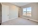 Bright bedroom with a large window and neutral carpet flooring at 5134 Cupule Trl, Castle Rock, CO 80104