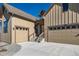 Front exterior of a two-story home with an attached garage and a stone accented driveway at 5134 Cupule Trl, Castle Rock, CO 80104