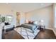 Comfortable bedroom with neutral tones, a plush rug, recessed lighting, and an ensuite bathroom at 5134 Cupule Trl, Castle Rock, CO 80104