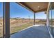 A cozy patio area with ample space and an open view of surrounding landscape at 5134 Cupule Trl, Castle Rock, CO 80104