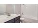 Clean bathroom with white tile, bathtub, and vanity at 2370 W 167Th Ln, Broomfield, CO 80023