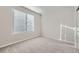 Bright bedroom with neutral walls and plush carpeting at 2370 W 167Th Ln, Broomfield, CO 80023