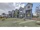 Row of new townhouses with gray siding and landscaping at 2370 W 167Th Ln, Broomfield, CO 80023