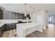 Modern kitchen with white countertops and dark gray cabinets at 2370 W 167Th Ln, Broomfield, CO 80023