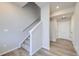 Modern staircase with carpeted steps and a neutral color palette at 2370 W 167Th Ln, Broomfield, CO 80023