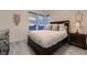Cozy bedroom featuring a comfortable bed, stylish decor, and large windows with scenic views at 8868 Geyser Peak Way, Parker, CO 80138