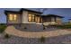 Beautiful home exterior with stone accents, modern windows, and attractive landscaping at 8868 Geyser Peak Way, Parker, CO 80138