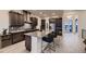 Modern kitchen with granite countertops, stainless steel appliances, and breakfast bar at 8868 Geyser Peak Way, Parker, CO 80138