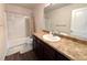This bathroom features a sink with a long vanity and a shower-tub combo at 47373 Lily Ave, Bennett, CO 80102