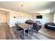 Comfortable living room area featuring hardwood floors, recessed lights, and neutral walls at 47373 Lily Ave, Bennett, CO 80102