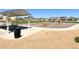 Community playground with swings, climbing structures, and picnic area for outdoor fun at 47373 Lily Ave, Bennett, CO 80102