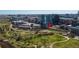 Aerial view capturing the building, nearby park, city skyline and green spaces, providing a sense of location at 1690 Bassett St # 6, Denver, CO 80202