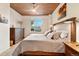 Inviting bedroom with a king-sized bed, soft bedding, and elegant bedside tables and modern ceiling fan at 1690 Bassett St # 6, Denver, CO 80202