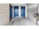 Hallway with doors and cinder block, leading to various rooms in the building at 1690 Bassett St # 6, Denver, CO 80202