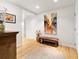 Entry hall with wood floors, artwork, and stylish furniture at 1690 Bassett St # 6, Denver, CO 80202