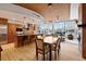 Open-concept kitchen, dining and living area with large windows and modern furnishings and wood floors at 1690 Bassett St # 6, Denver, CO 80202