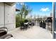 Relaxing patio featuring a dining table set, stylish planters, and outdoor seating, great for entertaining or enjoying the outdoors at 1690 Bassett St # 6, Denver, CO 80202