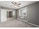 Bedroom with mirrored closet doors, ceiling fan, and window with blinds at 2700 S Holly St # 225, Denver, CO 80222