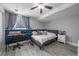 Comfortable bedroom features hardwood style flooring, a ceiling fan, and a window with natural light at 10177 E Peakview Ave, Englewood, CO 80111