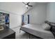 Well-lit bedroom with a sloped ceiling, spacious closet, and a simple, neutral decor at 10177 E Peakview Ave, Englewood, CO 80111