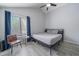 Clean bedroom with vaulted ceiling, closet space, and a large window with bright natural light at 10177 E Peakview Ave, Englewood, CO 80111