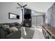 Cozy living room featuring a fireplace and sliding glass doors to the patio, ideal for entertaining at 10177 E Peakview Ave, Englewood, CO 80111