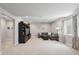 Finished basement offers additional living space with a large entertainment center and comfortable seating at 16268 Mount Silverheels Way, Broomfield, CO 80023