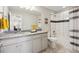 Modern bathroom with stylish tile work, updated fixtures, and a combined shower-tub at 16268 Mount Silverheels Way, Broomfield, CO 80023