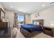 Inviting bedroom features a comfortable bed, coordinating decor, and a large window for natural light at 16268 Mount Silverheels Way, Broomfield, CO 80023