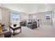 Cozy bonus room with neutral colors, soft carpet, comfortable seating, and natural light at 16268 Mount Silverheels Way, Broomfield, CO 80023